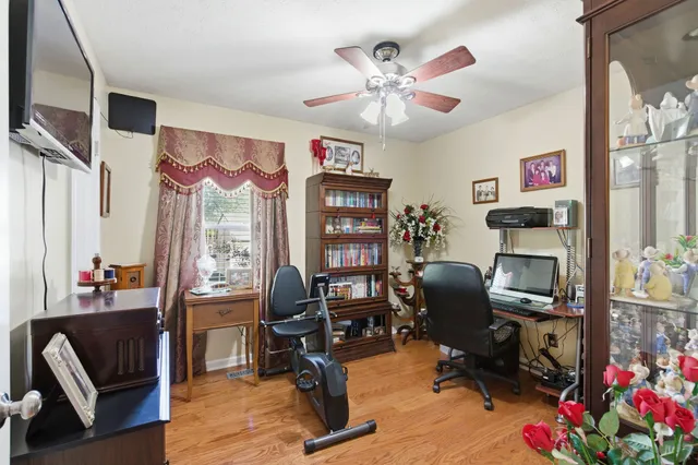 a view of a workspace with furniture and a livingroom