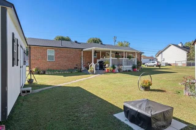 a view of a house with swimming pool yard and patio