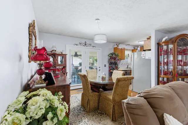 a living room with furniture and flowers