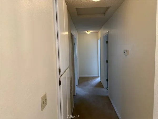 a view of hallway with closet