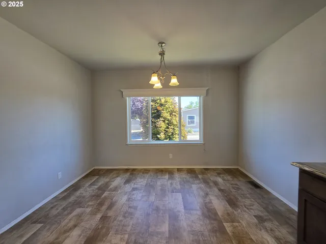 a kitchen with stainless steel appliances a sink stove and refrigerator