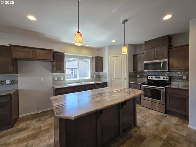 a view of hallway with an empty room