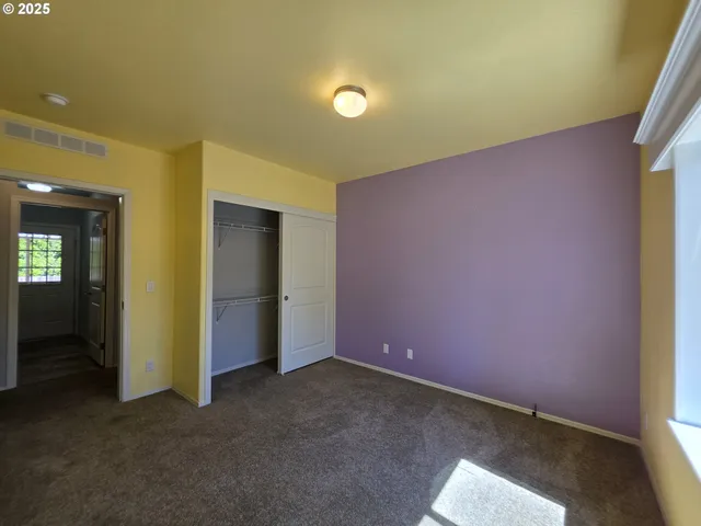 an empty room with a empty space and a window