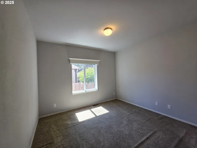 an empty room with closet area