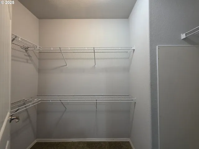 a bathroom with a shower sink and mirror