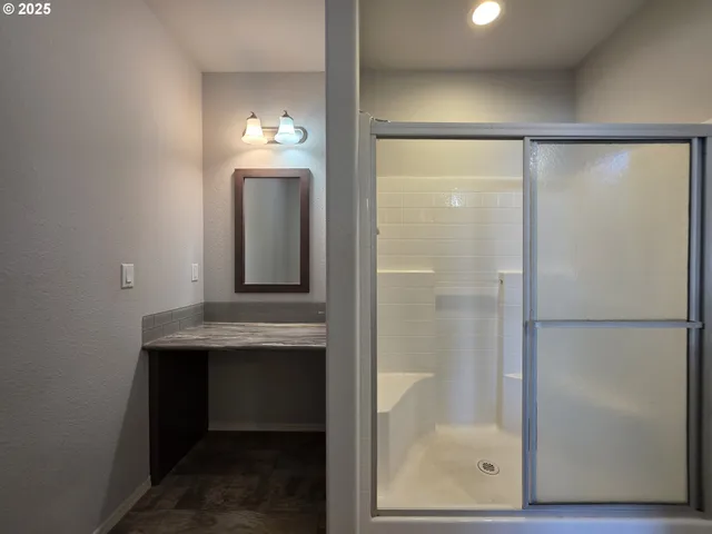 a bathroom with a sink a toilet and mirror