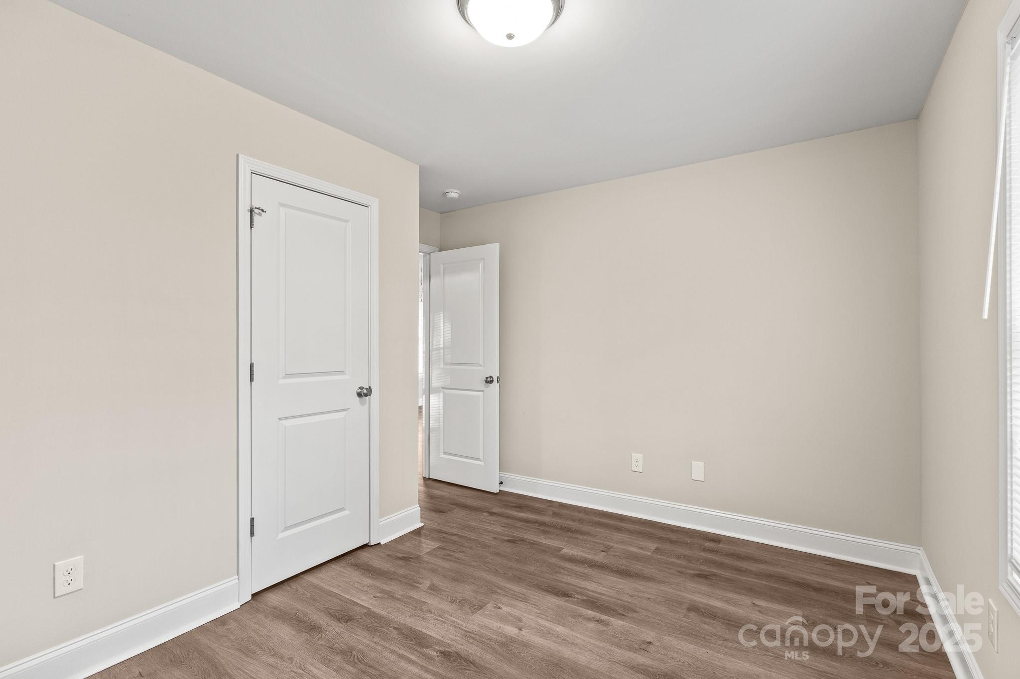 1219 Calhoun Street Rock Hill, SC 29732 - Photo 22 of 33 a view of an empty room with wooden floor