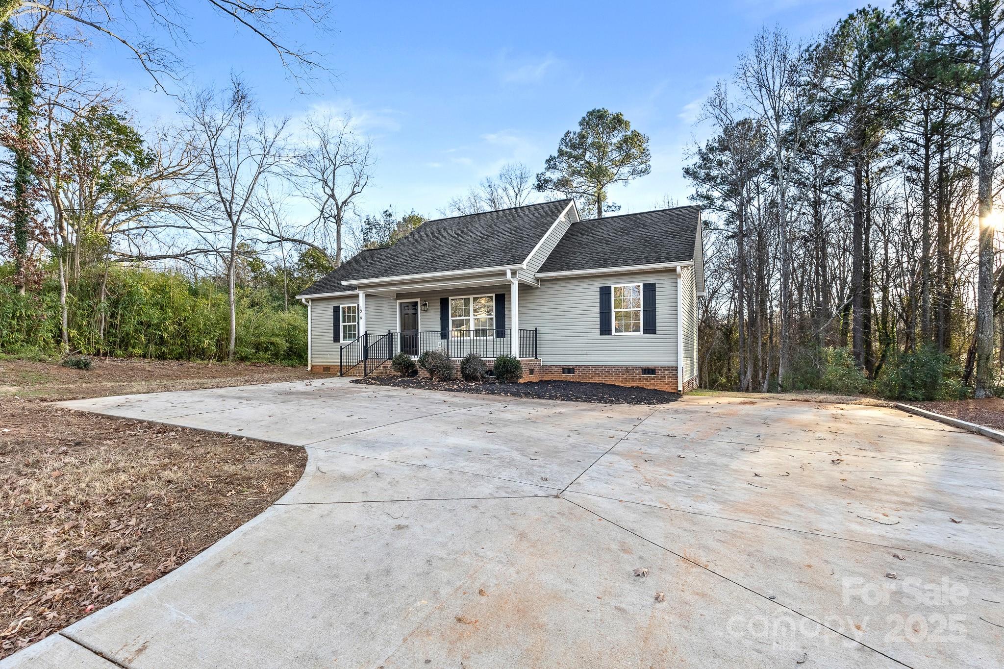 1219 Calhoun Street Rock Hill, SC 29732 - Photo 28 of 33 a front view of a house with a garden