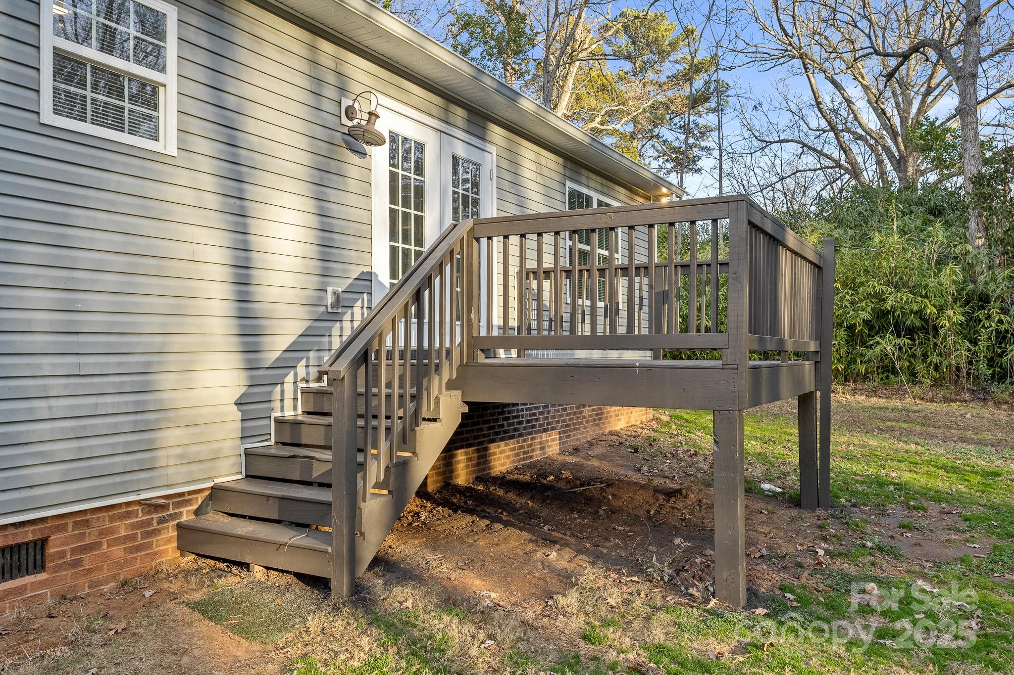 1219 Calhoun Street Rock Hill, SC 29732 - Photo 31 of 33 a view of a house with a small yard and wooden deck