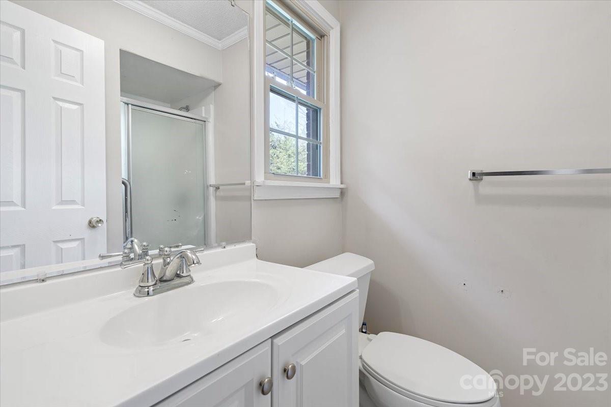 750 Lakeview Road Salisbury, NC 28147 - Photo 14 of 22 a bathroom with a sink vanity mirror and toilet