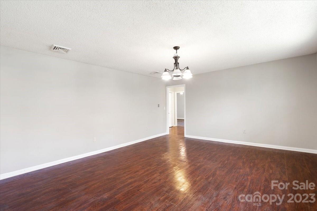 750 Lakeview Road Salisbury, NC 28147 - Photo 2 of 22 a view of an empty room with wooden floor