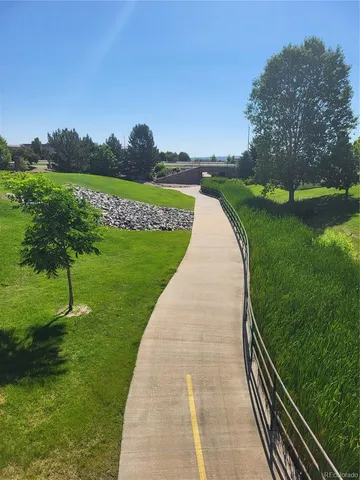 a view of a lake with houses in the background