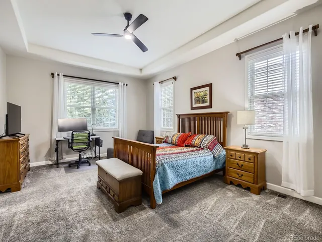 a bedroom with a bed and a couch