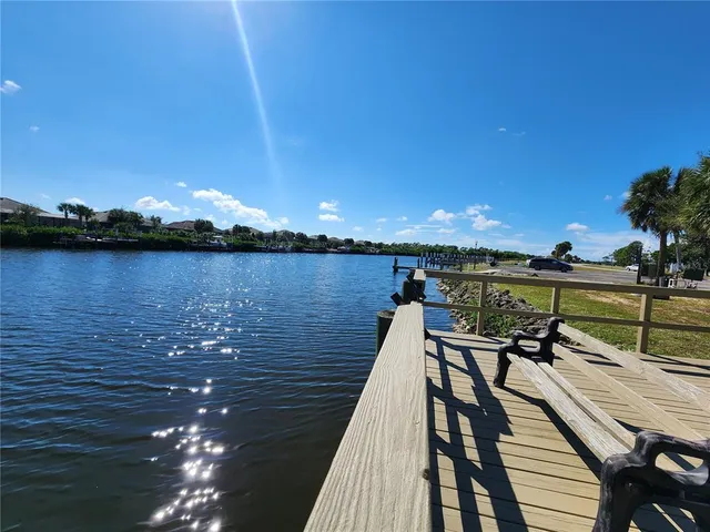 a view of swimming pool with outdoor seating