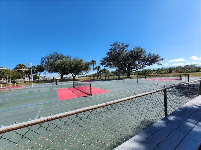 a view of swimming pool with wooden deck and lake view