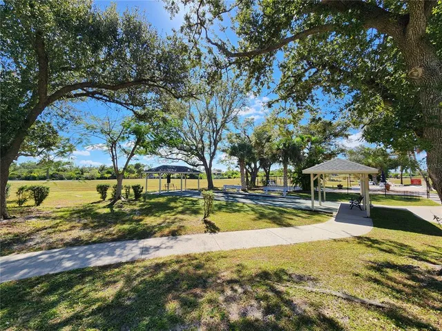a view of a swimming pool with a patio