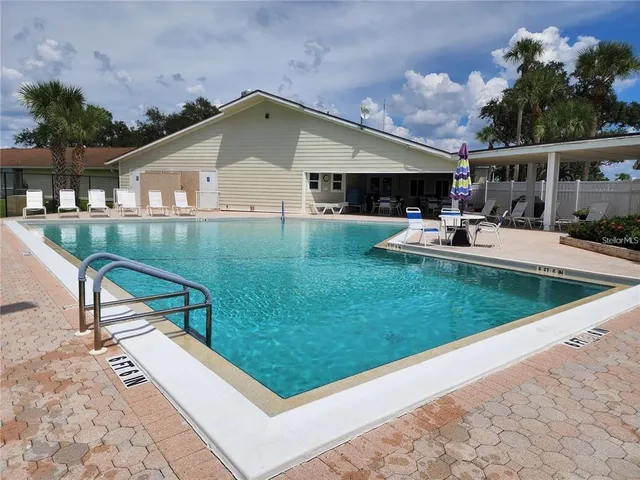 a front view of house with yard and patio