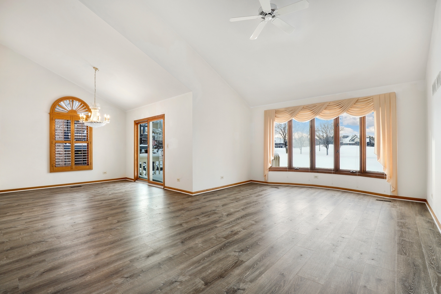 14518 Golf Road Orland Park, IL 60462 - Photo 11 of 42 an empty room with wooden floor and windows