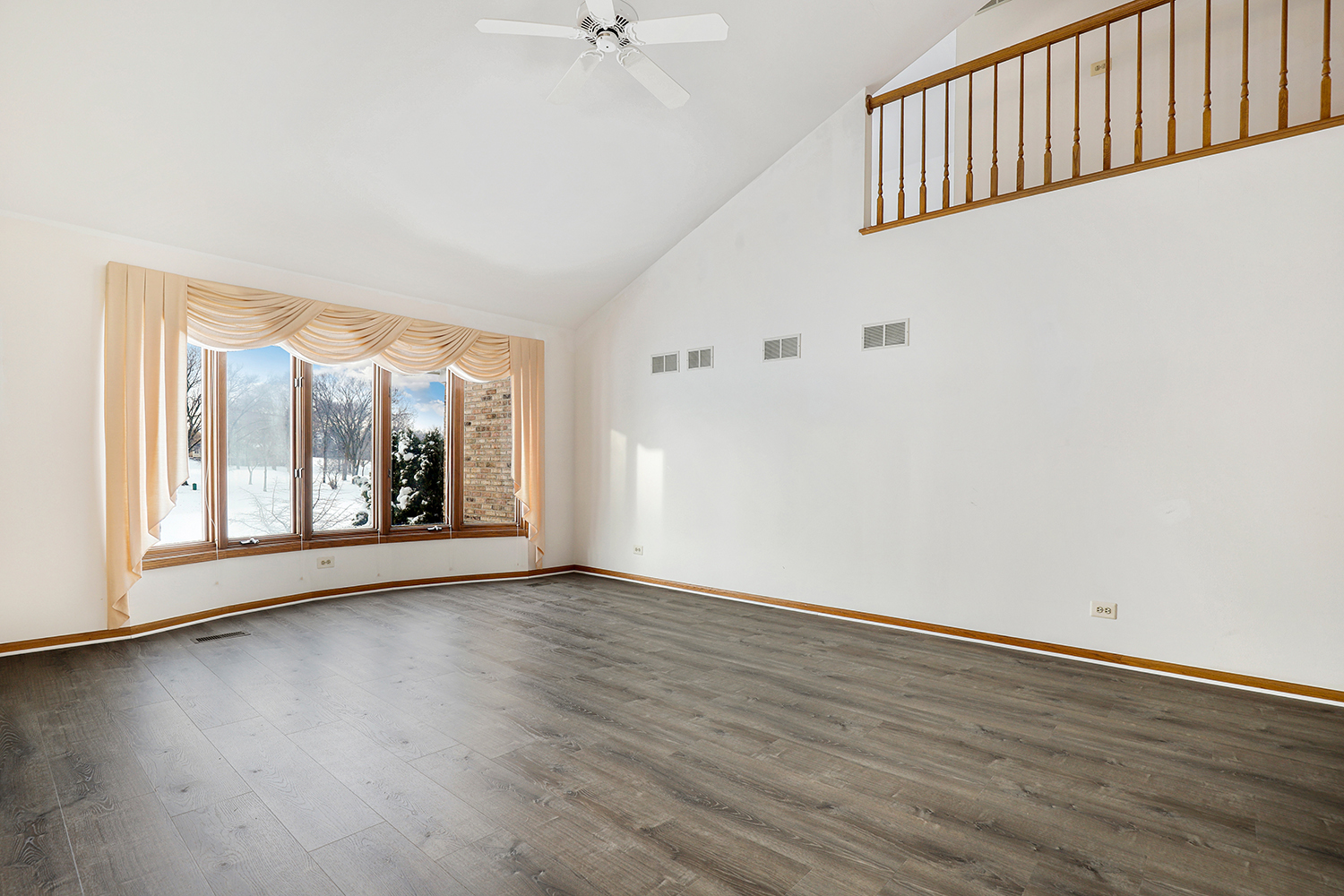 14518 Golf Road Orland Park, IL 60462 - Photo 13 of 42 a view of an empty room with wooden floor and a window