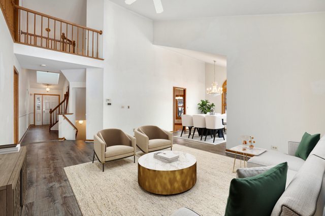 14518 Golf Road Orland Park, IL 60462 - Photo 14 of 42 a living room with furniture and a dining table