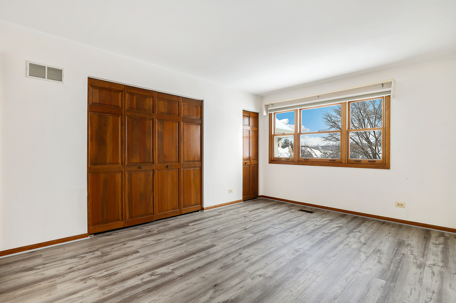 14518 Golf Road Orland Park, IL 60462 - Photo 21 of 42 an empty room with wooden floor and windows