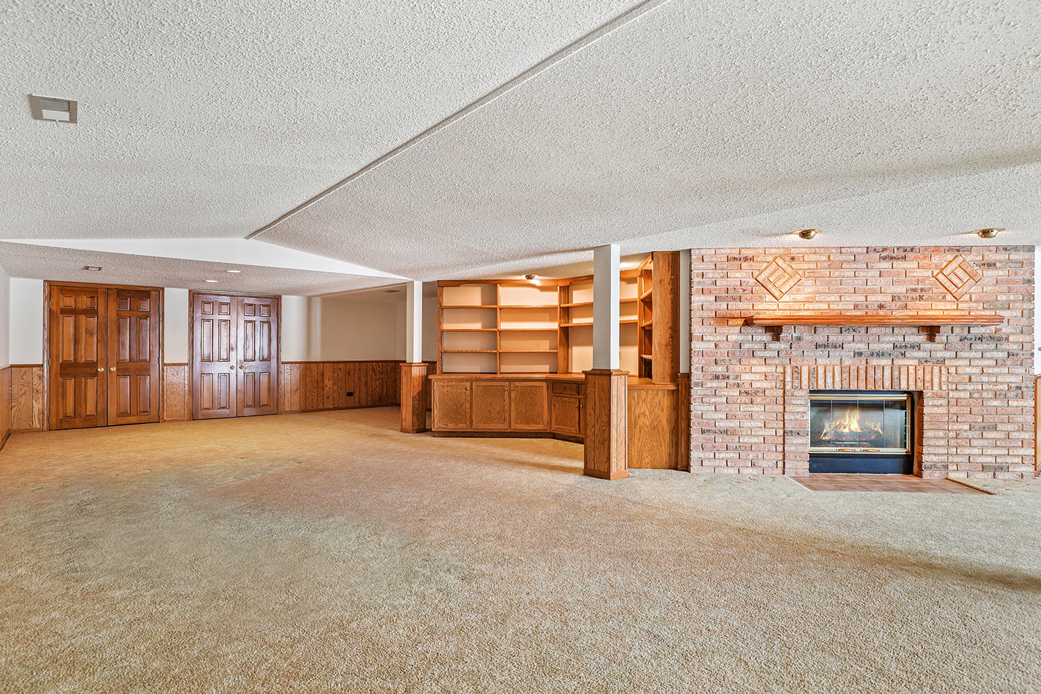 14518 Golf Road Orland Park, IL 60462 - Photo 31 of 42 an empty room with furniture and a fireplace