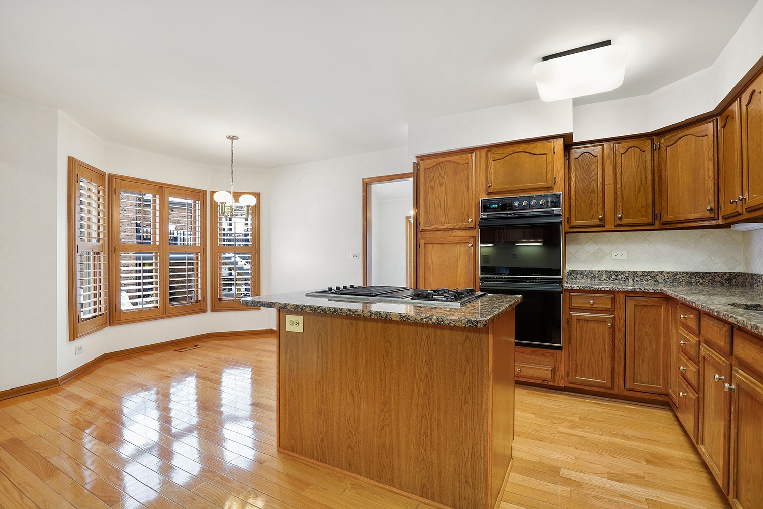 14518 Golf Road Orland Park, IL 60462 - Photo 5 of 42 a kitchen with stainless steel appliances granite countertop a stove a sink and a refrigerator