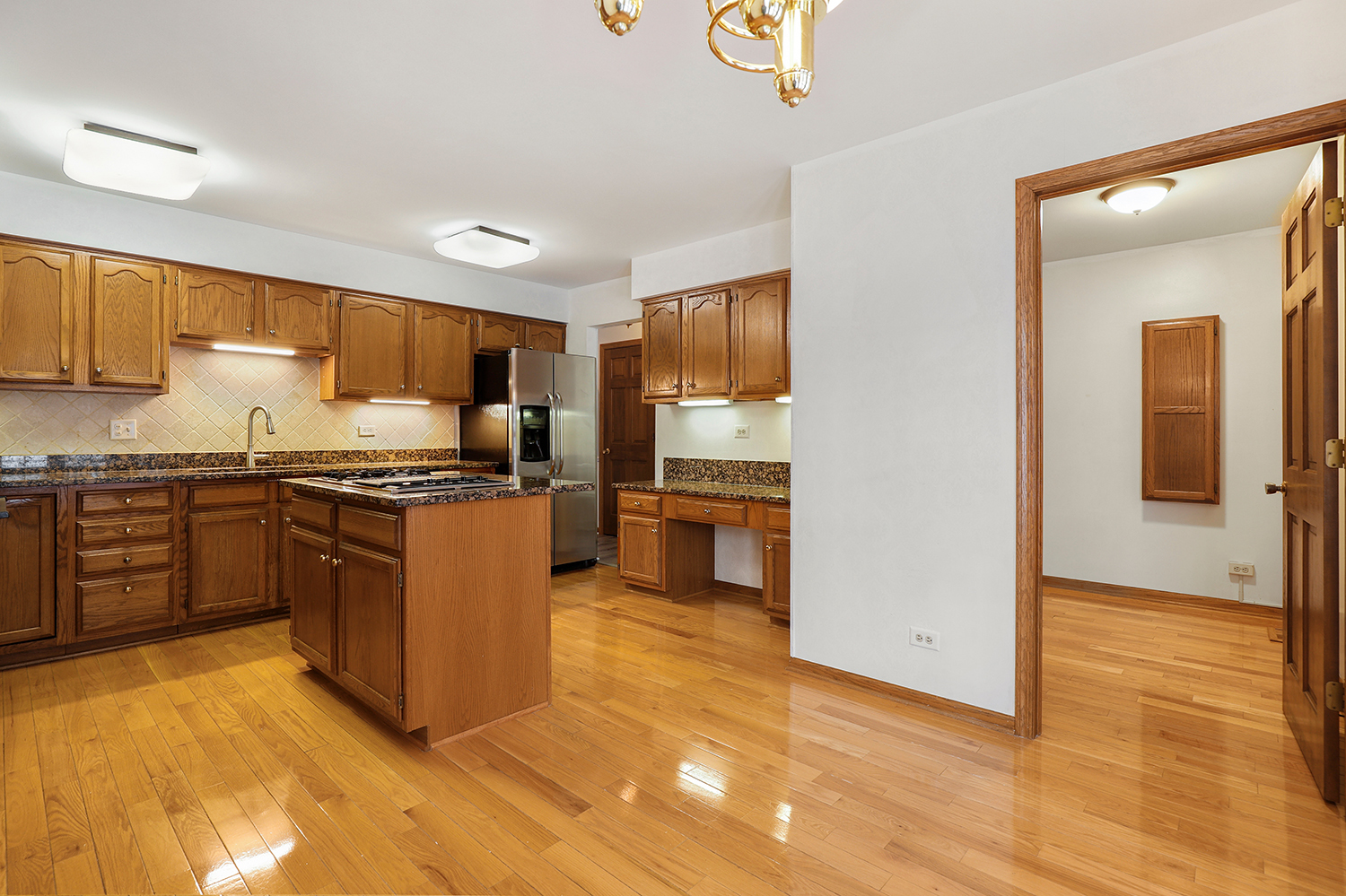 14518 Golf Road Orland Park, IL 60462 - Photo 7 of 42 a kitchen with stainless steel appliances granite countertop a stove a sink and a refrigerator