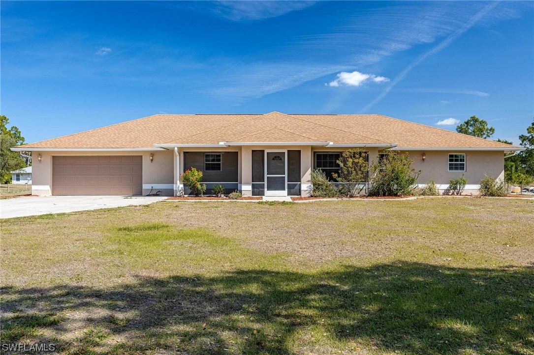 a front view of a house with swimming pool having outdoor seating