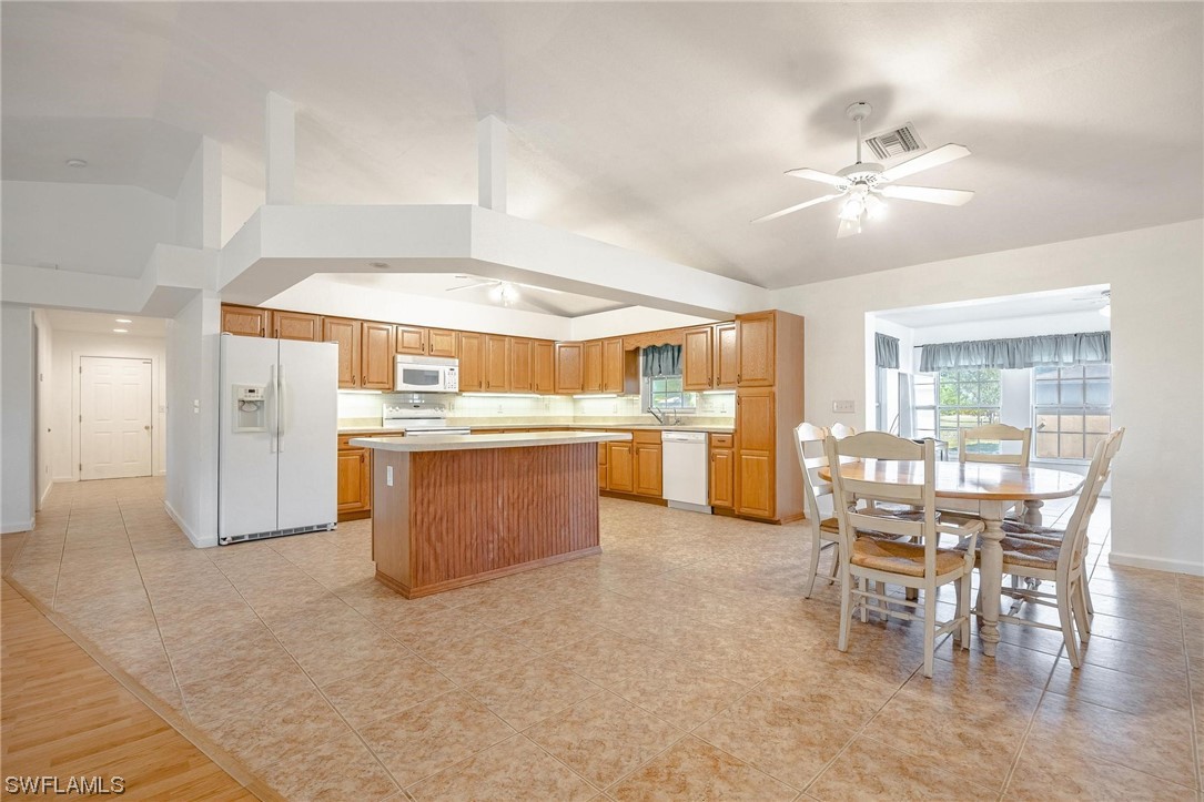 7764 14th Place LaBelle, FL 33935 - Photo 11 of 34 a room with stainless steel appliances kitchen island granite countertop furniture and a kitchen view