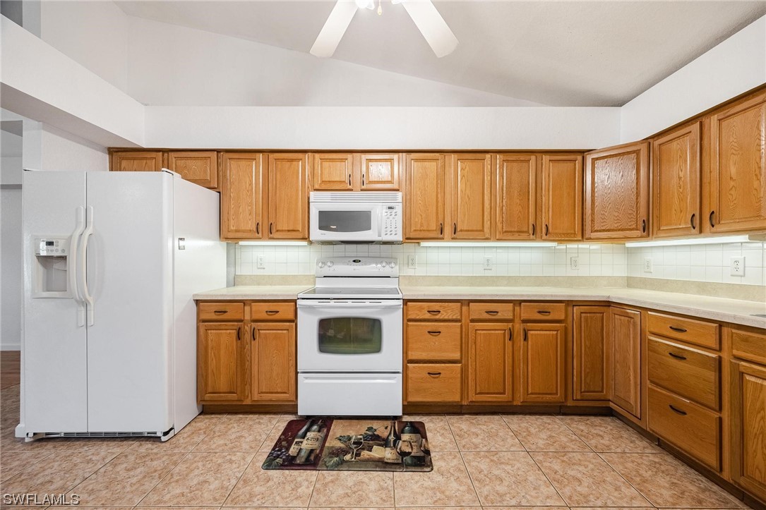 7764 14th Place LaBelle, FL 33935 - Photo 16 of 34 a kitchen with sink cabinets and stainless steel appliances