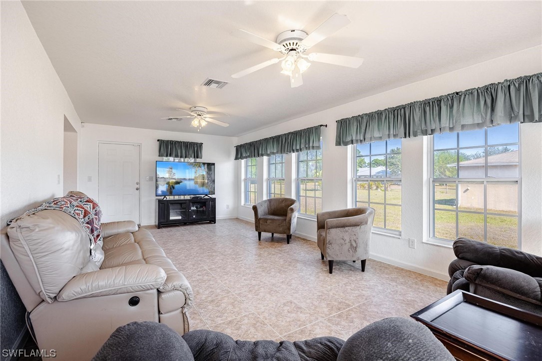 7764 14th Place LaBelle, FL 33935 - Photo 19 of 34 a living room with furniture and a large window