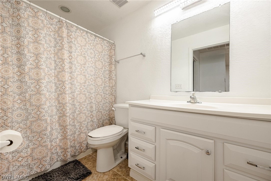 7764 14th Place LaBelle, FL 33935 - Photo 24 of 34 a bathroom with a sink toilet and shower