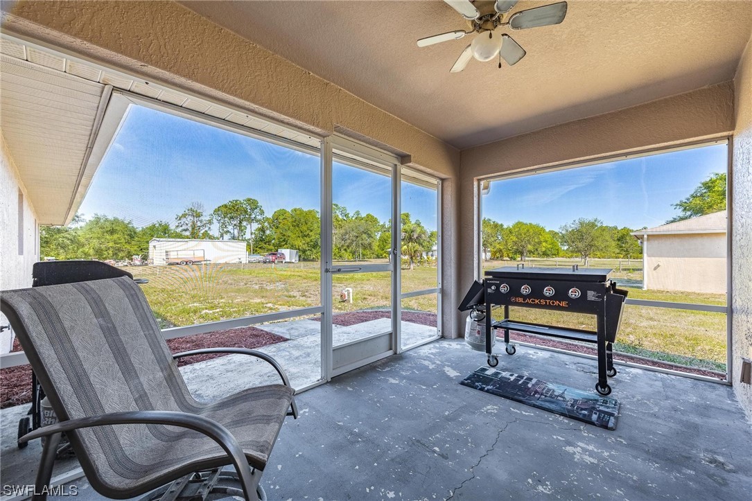 7764 14th Place LaBelle, FL 33935 - Photo 28 of 34 a view of a chairs and table in patio