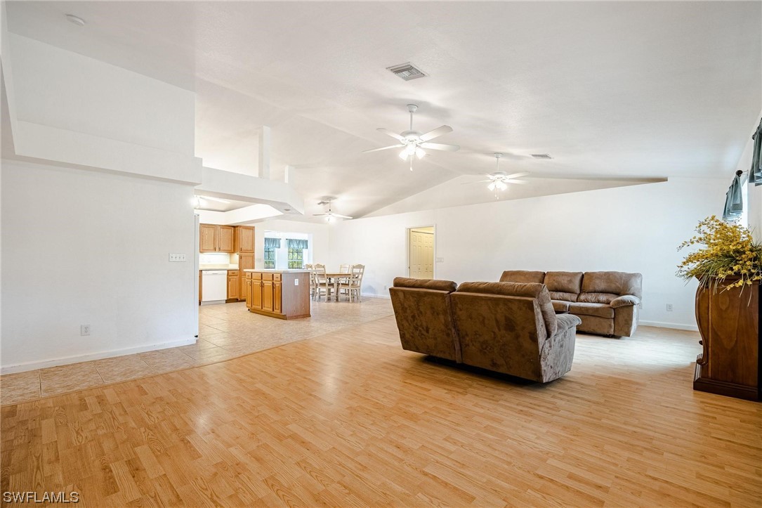7764 14th Place LaBelle, FL 33935 - Photo 3 of 34 a living room with furniture and a wooden floor