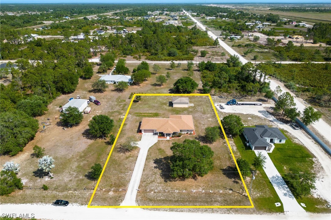 7764 14th Place LaBelle, FL 33935 - Photo 32 of 34 an aerial view of residential houses with outdoor space