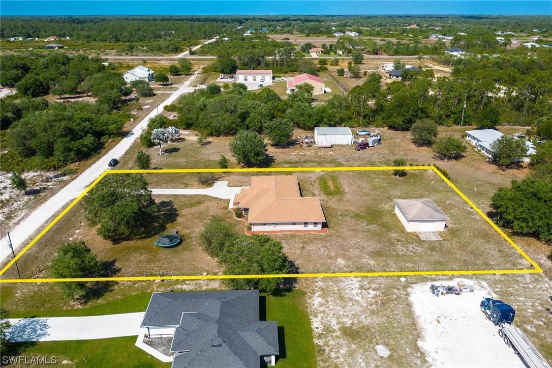 7764 14th Place LaBelle, FL 33935 - Photo 33 of 34 an aerial view of residential houses with outdoor space