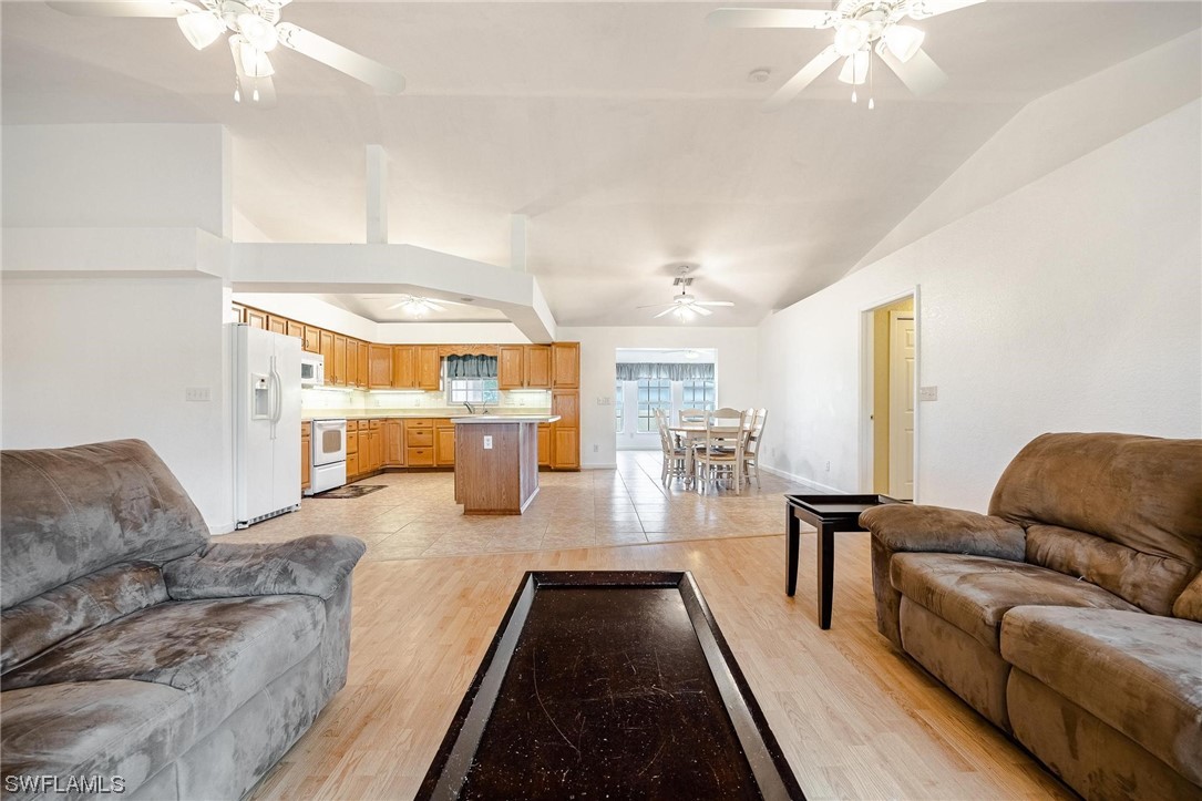 7764 14th Place LaBelle, FL 33935 - Photo 4 of 34 a living room with furniture and a chandelier