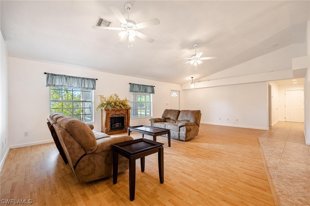 7764 14th Place LaBelle, FL 33935 - Photo 6 of 34 a living room with furniture and a fireplace