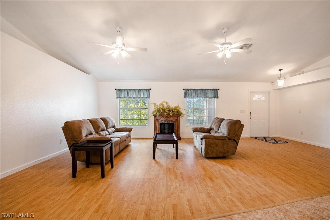 7764 14th Place LaBelle, FL 33935 - Photo 9 of 34 a living room with furniture and wooden floor