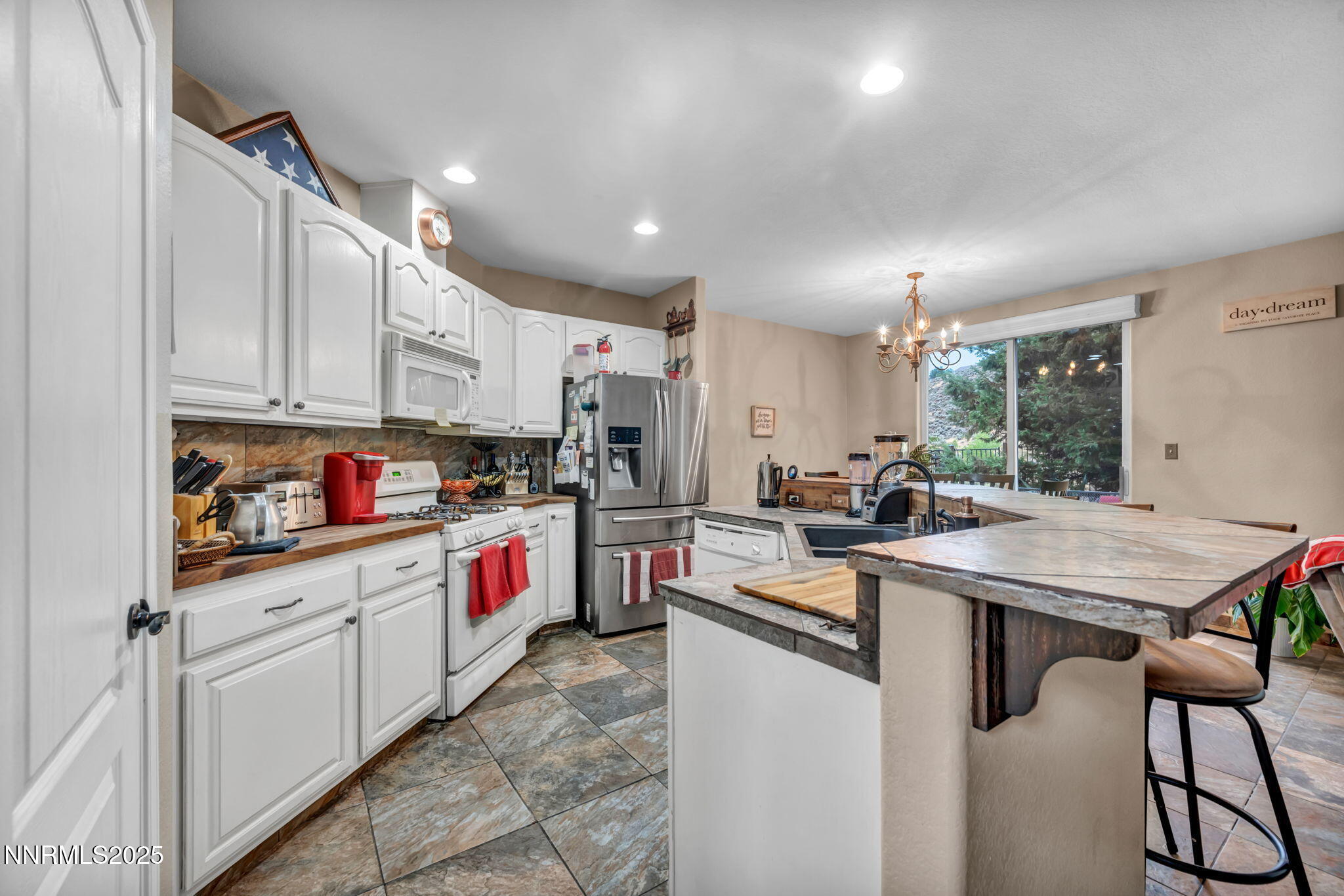2971 Fox Trail Drive Reno, NV 89523 - Photo 11 of 45 a kitchen that has a lot of cabinets in it and appliances