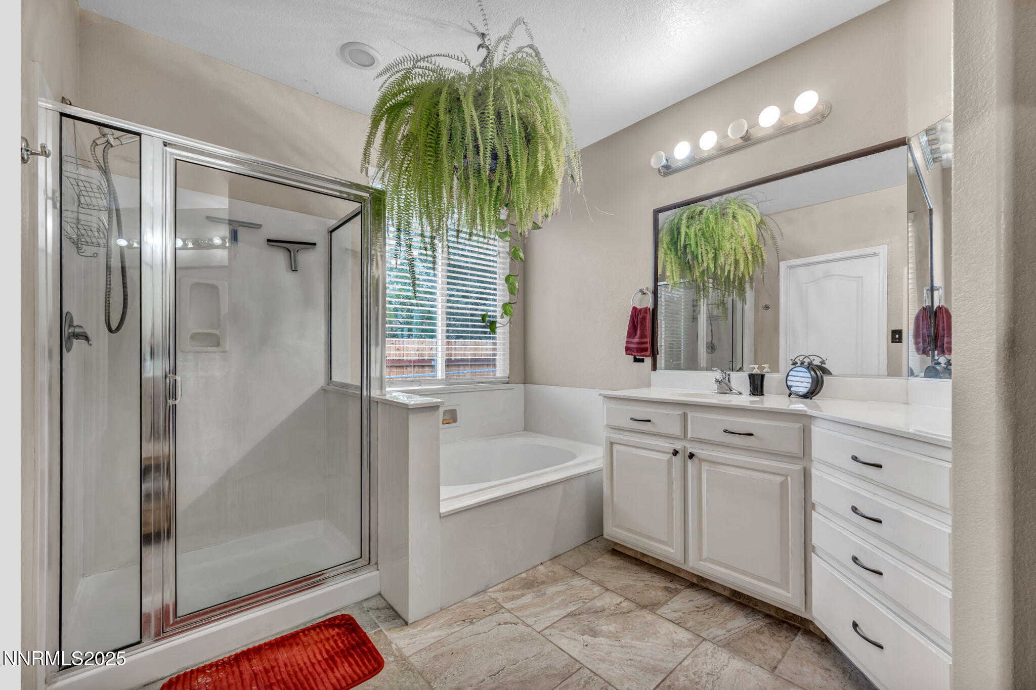 2971 Fox Trail Drive Reno, NV 89523 - Photo 19 of 45 a bathroom with a tub sink and a shower