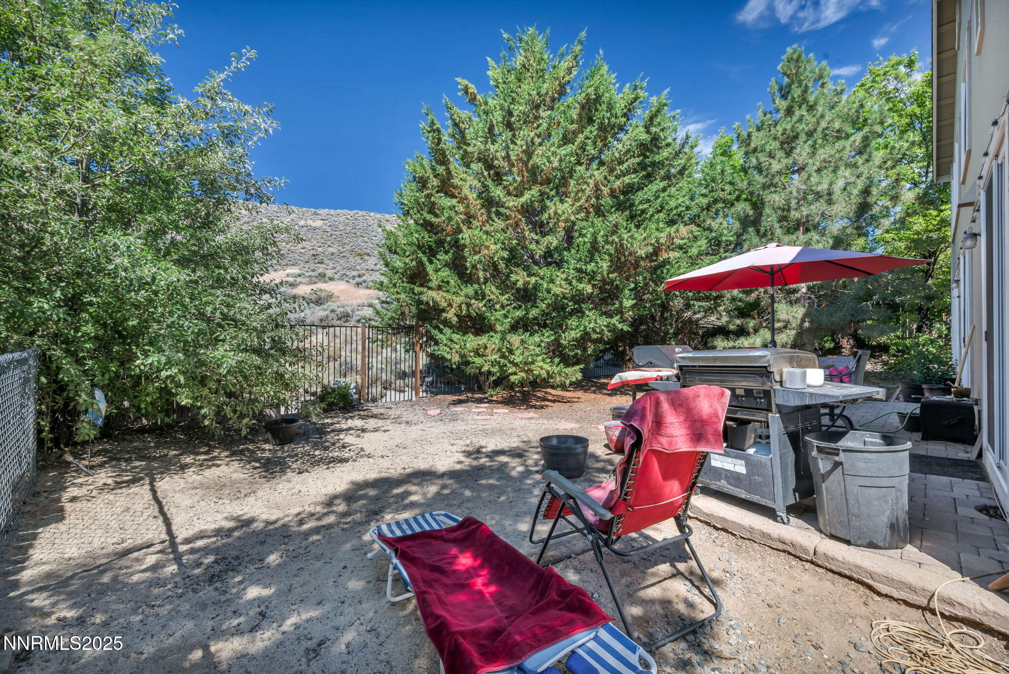 2971 Fox Trail Drive Reno, NV 89523 - Photo 34 of 45 an outdoor sitting area with an umbrella