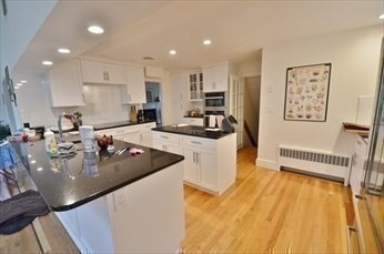 45 Wellesley Road Belmont, MA 02478 - Photo 8 of 39 a kitchen with stainless steel appliances granite countertop a sink a stove and a refrigerator