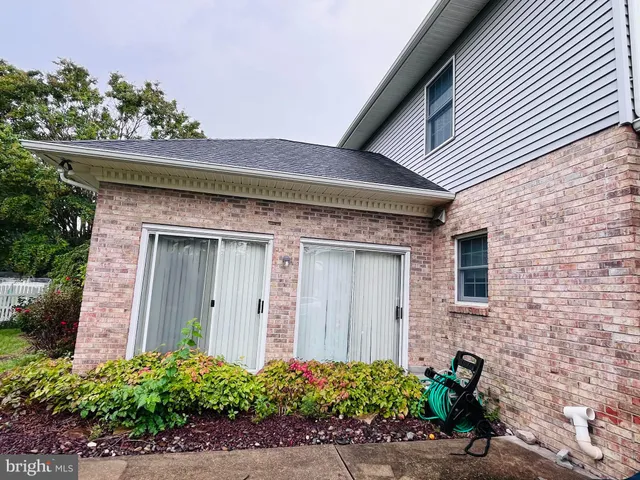 front view of a house with potted plants