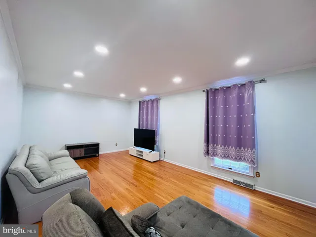 a bed room with furniture and wooden floor