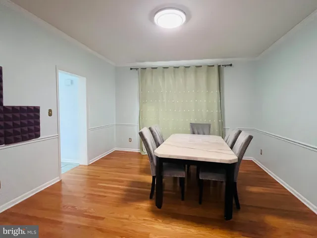 a workspace with furniture and wooden floor