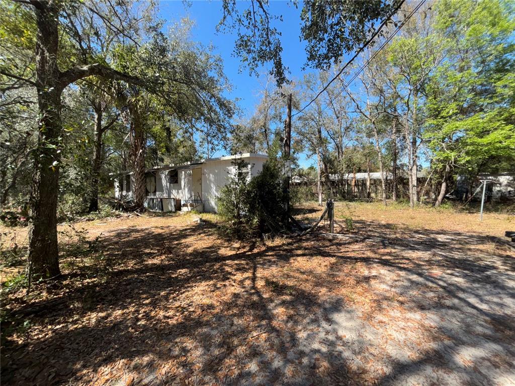 17233 Dalberg Drive Spring Hill, FL 34610 - Photo 21 of 24 a view of outdoor space yard and patio
