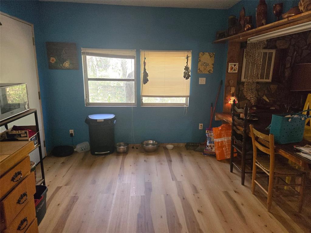 17233 Dalberg Drive Spring Hill, FL 34610 - Photo 24 of 24 a room with wooden floor and a window