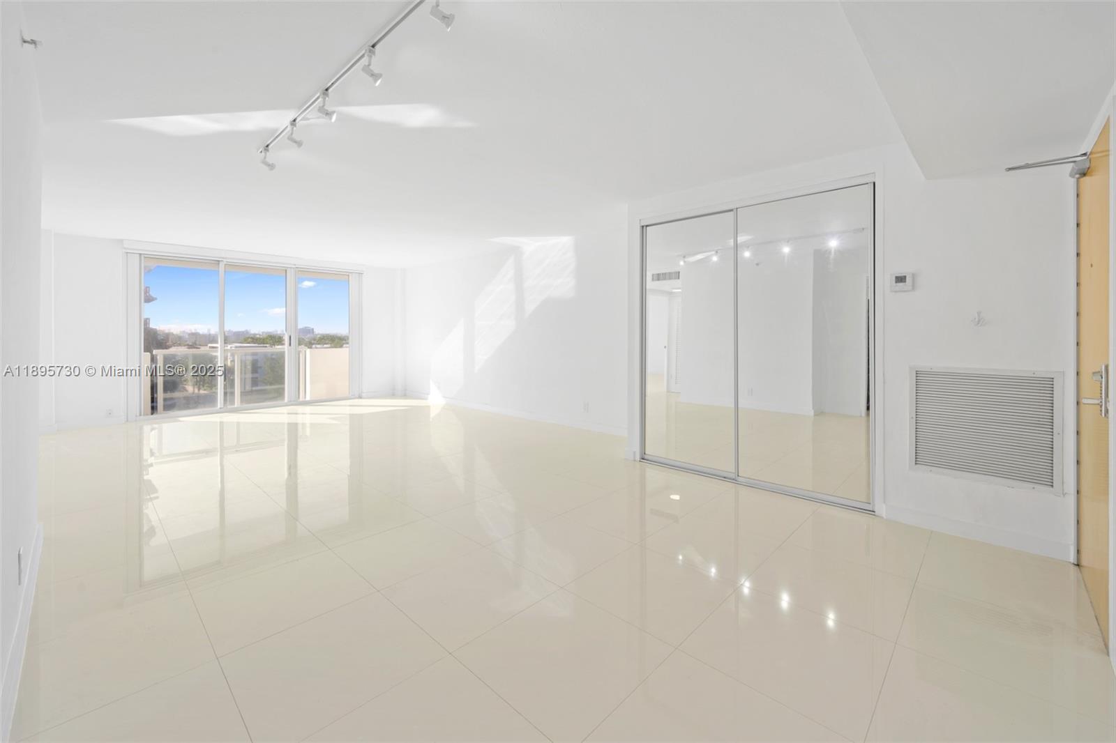 9195 Collins Avenue, Unit 812 Surfside, FL 33154 - Photo 20 of 20 a view of an empty room with a window